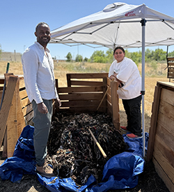 male and female working with composted materials