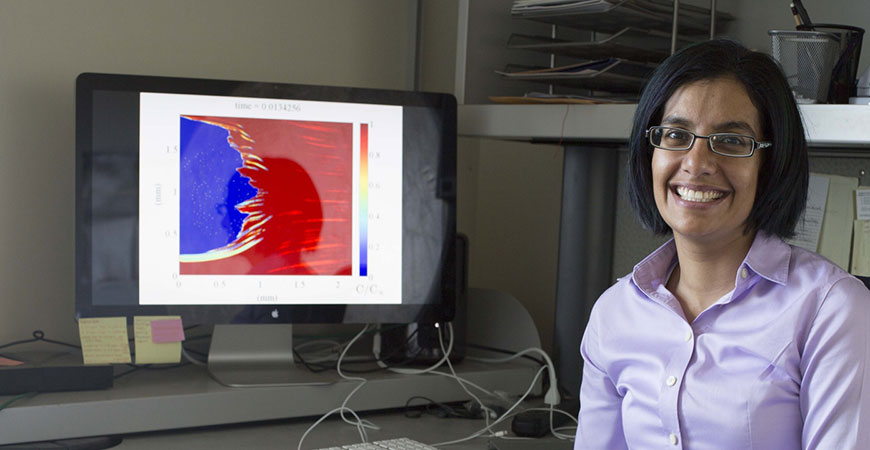 UC Merced Professor Shilpa Kahtri next to a computer