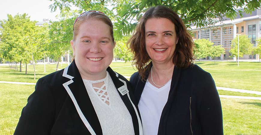 UC Merced employees Rachel Seymour and Amy Moffat pose together outdoors at UC Merced.