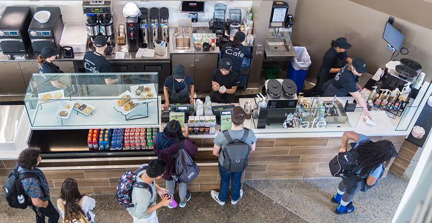 An aerial shot of The Lantern Cafe showing workers taking orders and serving customers.