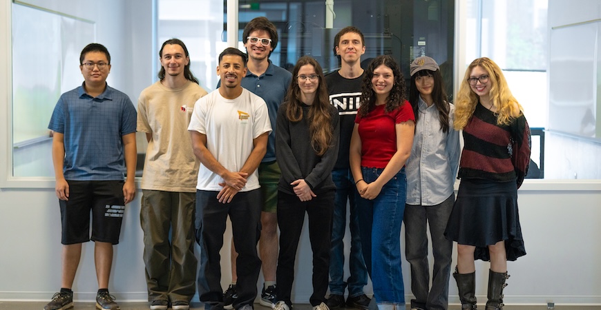 A group of students taking part in the InCuBaTE program is pictured standing in a room at UC Merced. 
