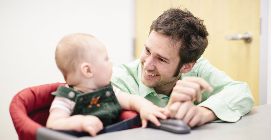 Professor Eric Walle with infant in UC Merced child development lab