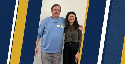 Photo depicts UC Merced Professor Christopher Viney and graduate researcher Kiana Shirzad on a blue and gold graphic background