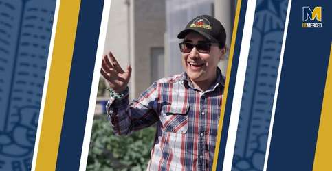 Photo depicts UC Merced graduate Adamaris Alvarez in a black hat on a blue and gold graphic background.
