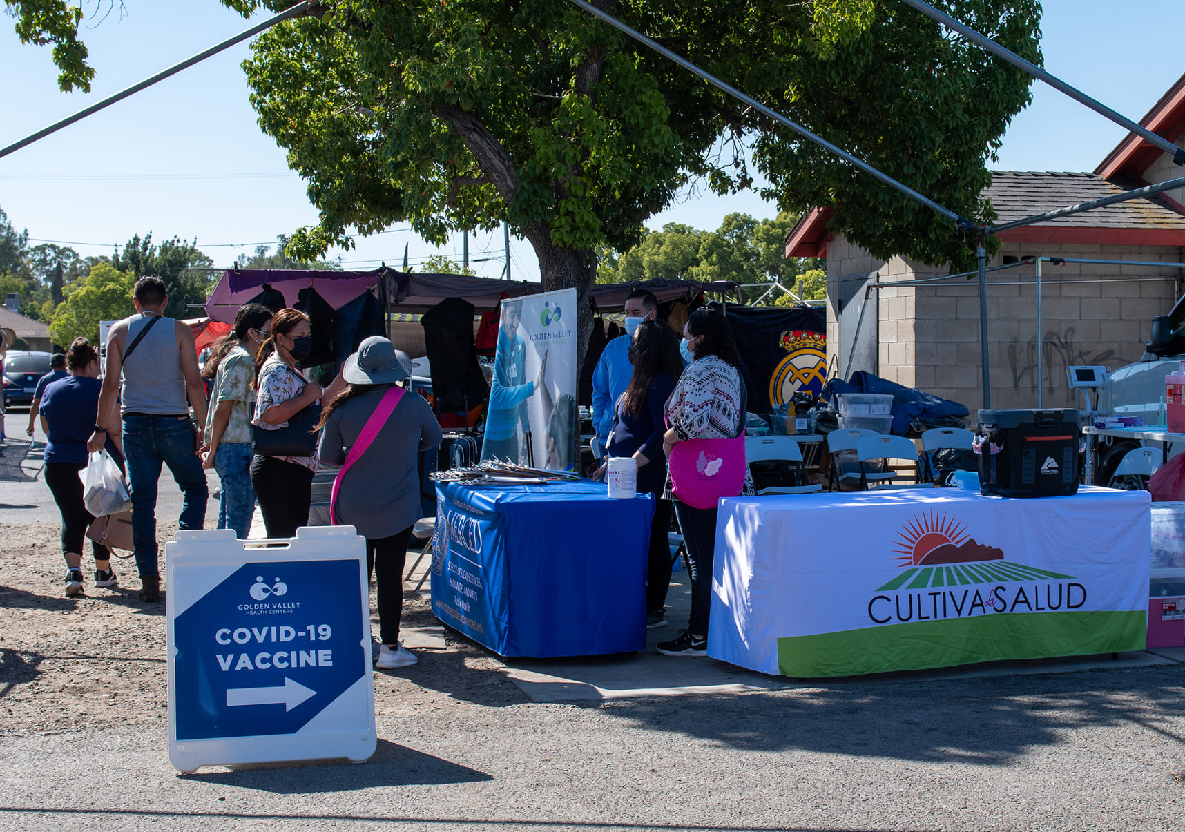 Members of the community learn about COVID-19 vaccines at the Atwater Flea Market.