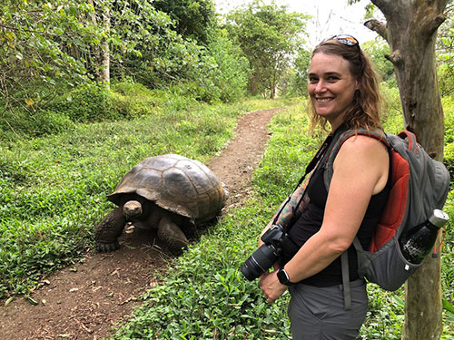 Professor Edwards and a giant tortoise in the Galapagos.