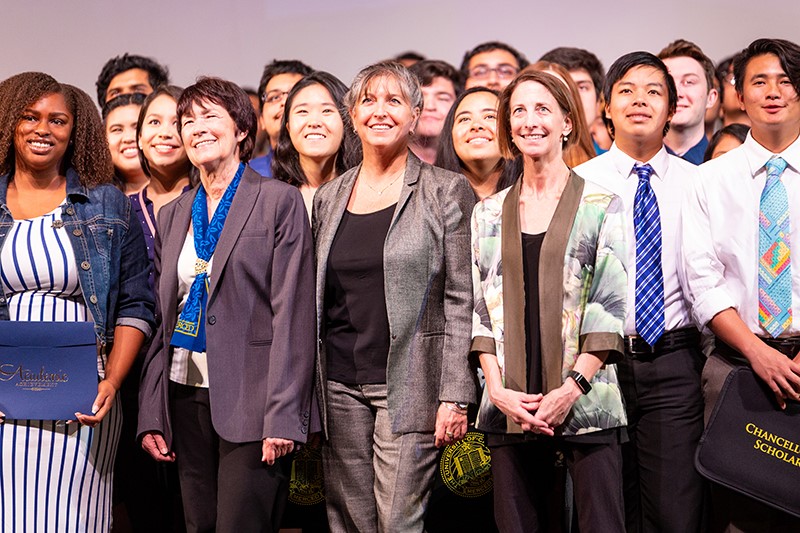 Crowd of people smiling at the camera