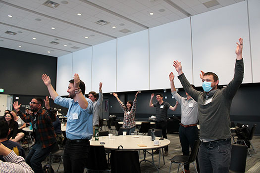 Conference attendees do a 'math dance.'