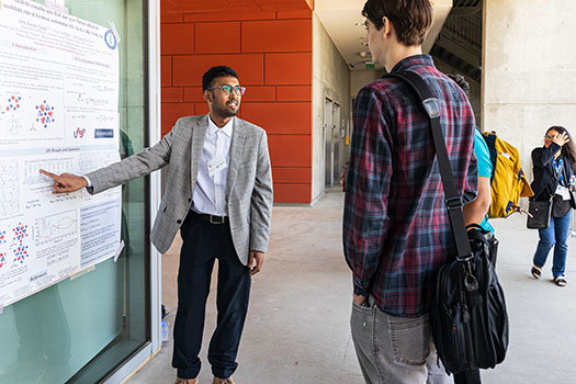 Poster presentations drew interested listeners.