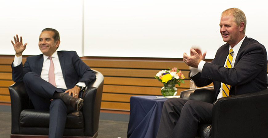 Antonio Villaraigosa and Nathan Brostrom sitting on stage