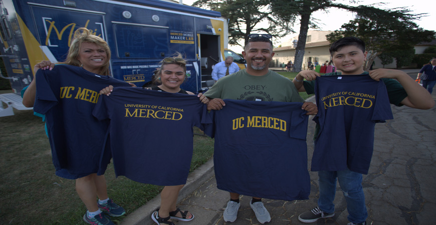 Fairgoers with UC Merced shirts