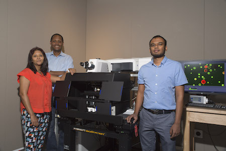 Subramaniam (right), Ghezzehei (center) and Ghosh (left) pose with the new Zeiss LSM 880 confocal microscope.