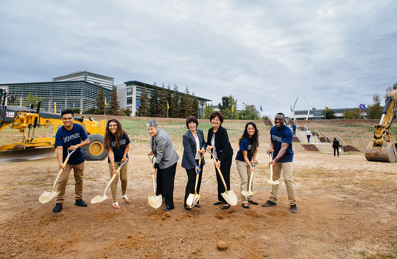 UC President Janet Napolitano (center left), UC Merced Chancellor Dorothy Leland (center) and UC Board of Regents Chairwoman Monica Lozano (center right) and UC Merced students ceremonially break ground to kick off the Merced 2020 Project.