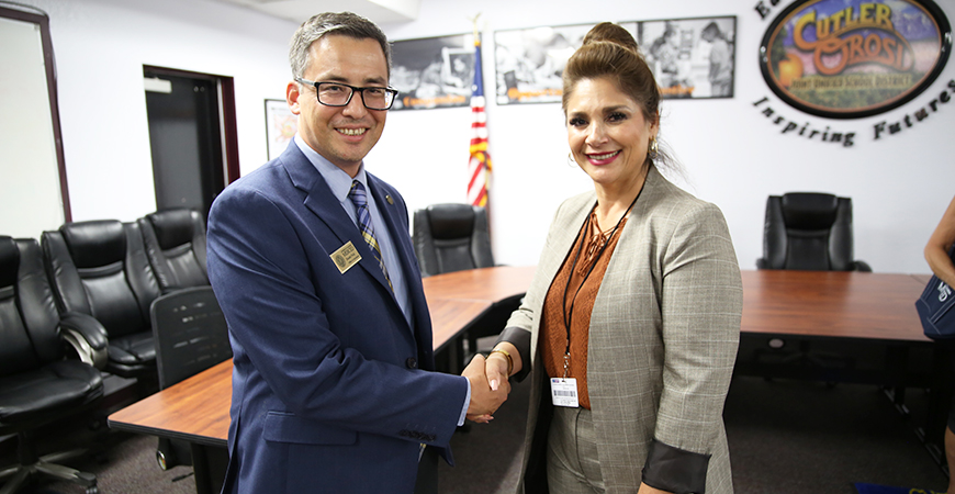 UC Merced Director of Admissions Dustin Noji and Cutler-Orosi Joint Unified School District Superintendent Yolanda Valdez pose for a photo.