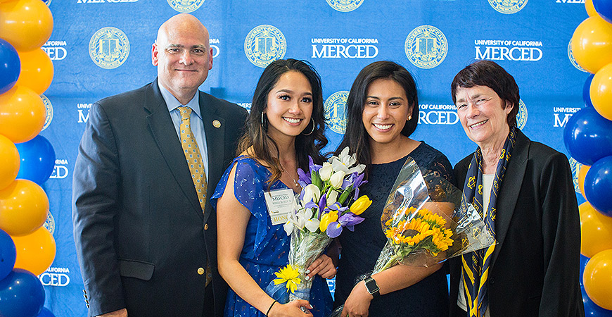 Vice Chancellor Ed Klotzbier, Monique de Villa (’16), Danielle Armedilla (’12), and Chancellor Dorothy Leland