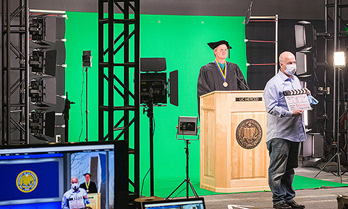 Saturday's commencement ceremony was pre-recorded the using green screen technology.