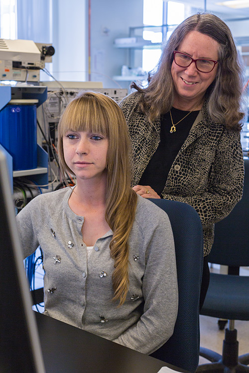 Professor Marilyn Fogel works with a student in her recently opened stable isotope lab.