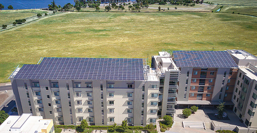 Solar panels atop campus buildings are just one factor in the campus's carbon neutrality.