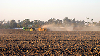 One of the ways people contract valley fever is by breathing in agricultural dust from soil where the fungus is present.