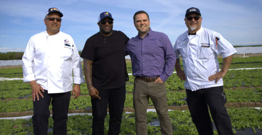 Chef Porter posing with Chefs Vanagten, Pangelina and local farmer Marc Marchini