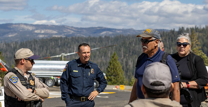 Seminar participants meet with representatives from California Highway Patrol, Cal Fire and the Yosemite National Park Rescue team at the Crane Flat heli-base.