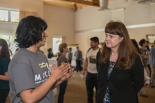 Tamara Jernigan, veteran of five NASA space flights (left) speaks with a MACES participant.