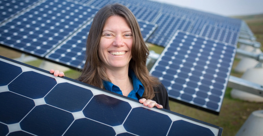 Sustainability Director Colleen McCormick and the UC Merced solar array