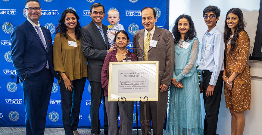 Chancellor Juan Sánchez Muñoz with the Mishra family at an event celebrating the naming of the Mahavir B. Mishra Executive Suite 