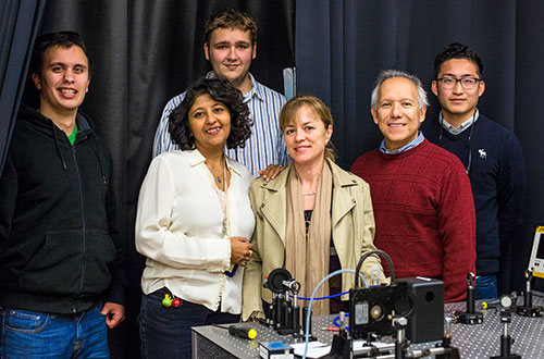 From left, students Joseph Silva and Seth Spitulski stand behind Professor Sai Ghosh, STEM Resource Center Coordinator Petia Gueorguieva, School of Natural Sciences Dean Juan Meza and student John Harvey Paredes, all part of the nanoBIO internship program.