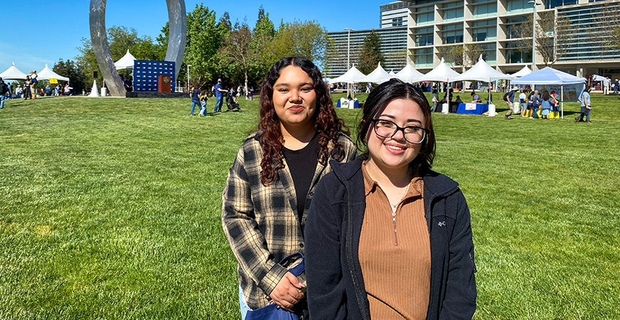 Two students pose for a photo in the Carol Tomlinson-Keasey Quad at UC Merced.