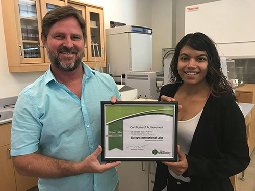 Instructional lab coordinator Jim Whalen and Green Labs intern Areli Orozco with Green Labs platinum certification