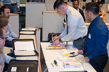 RevCon team members demonstrate a prototype of their cooling system.