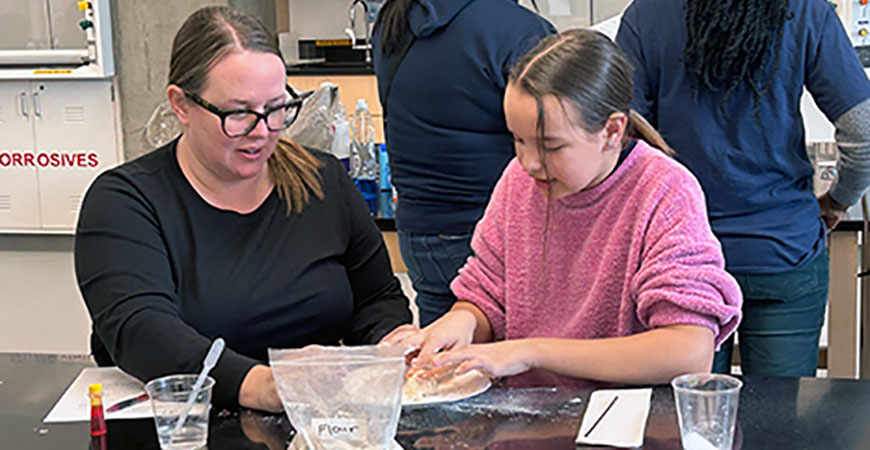 Mother and daughter conduct a science experiment.