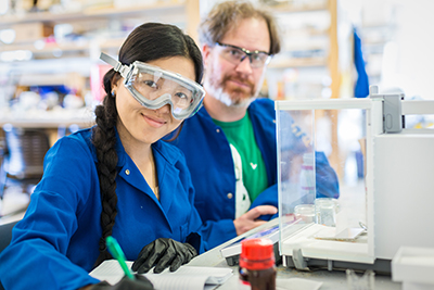 Mary Xiong, with Professor Erik Menke, is one of several local high school students gaining lab experience this summer.