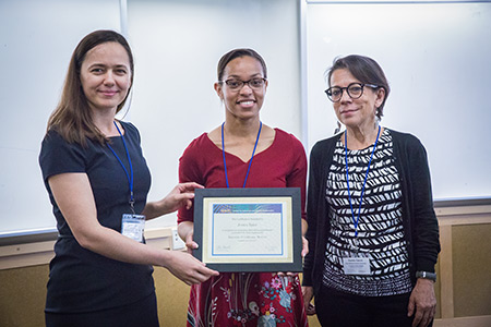 Professor Noemi Petra, left, and Professor Daniella Calvetti, right, present SIAM President Jessica Taylor, center, with a certificate of recognition. 