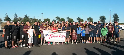 The Law Enforcement Torch Run to support Special Olympics passes through campus.