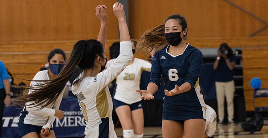 The women's volleyball team celebrates its success.