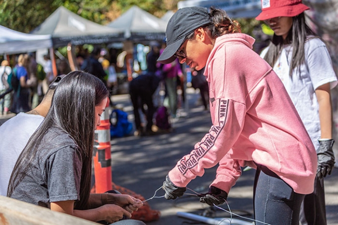 Students work together to build their sculpture from trash found in Yosemite National Park.