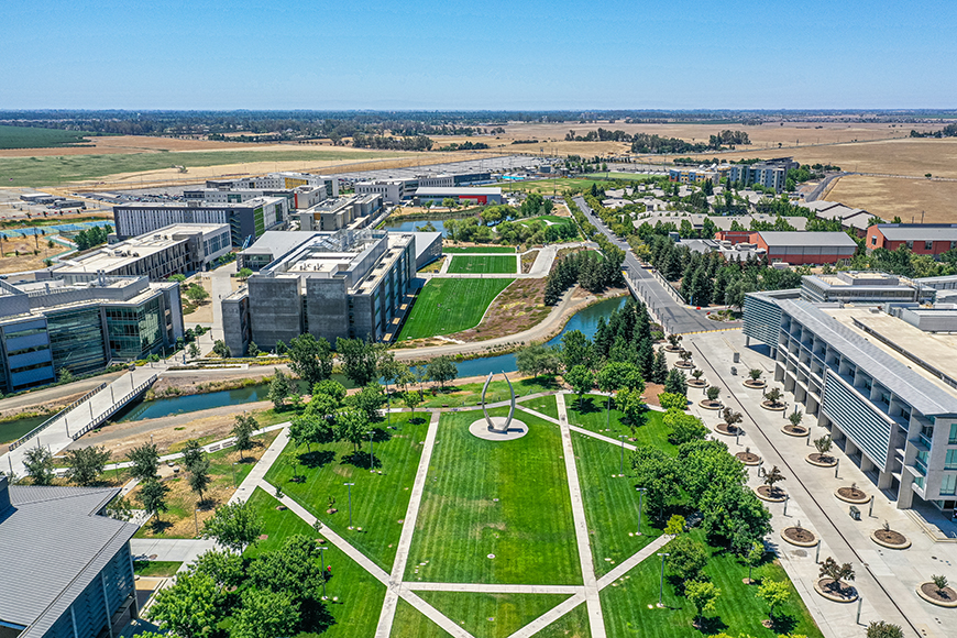 A photo shows an aerial view of UC Merced.