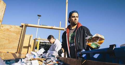 UC Merced students participate in a waste sorting line that recycles and composts landfill waste.