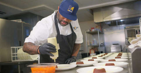 Chef Ed Porter adds finishing touches to dessert